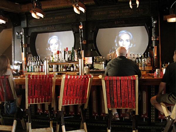 Behind the bar there are some m...